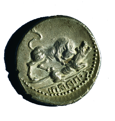 A silver coin of the Italic tribes with an Oscan inscription featuring a bull, symbol of Italia, attacking the Roman she-wolf, c.first century BC.