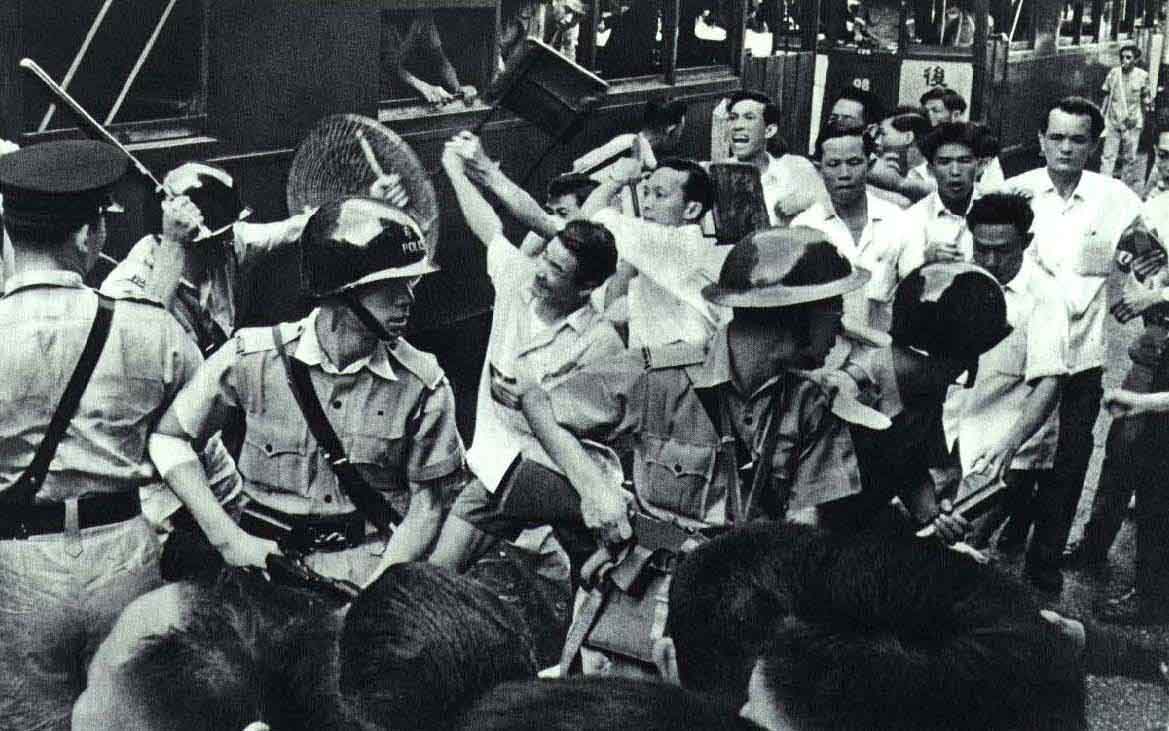 August 1967: Police clash with protestors at the Hong Kong tram workers strike. Wiki Commons.