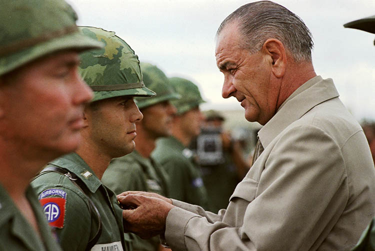 President Lyndon B. Johnson awards the Distinguished Service Cross to First Lieutenant Marty A. Hammer, in Vietnam, 1966.