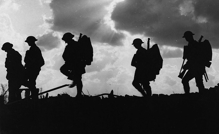 British soldiers moving forward during the Battle of Broodseinde. Photo by Ernest Brooks.
