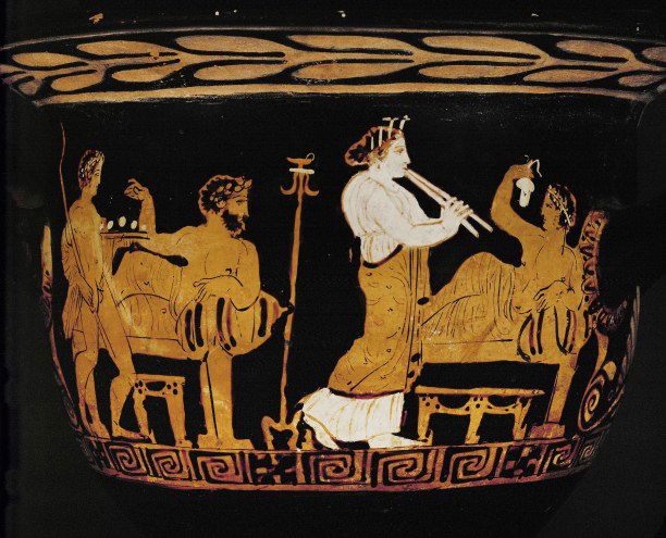 A scene from a drinking party on a Greek vase of the fourth century BC. AKG Images/Erich Lessing/Musee du Louvre