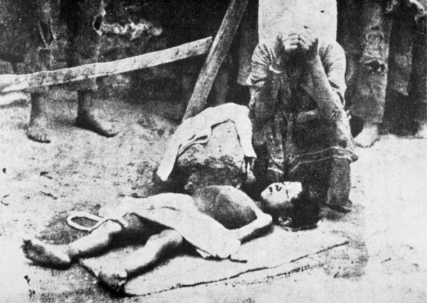 A woman mourns a child during the deportation of Armenians by the Turks, 1915. Getty Images/AFP