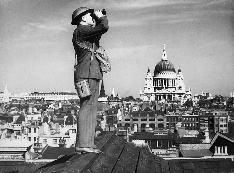 A Royal Observer Corps spotter scans the skies of London