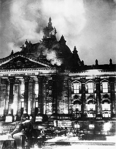 Firemen work on the burning Reichstag.