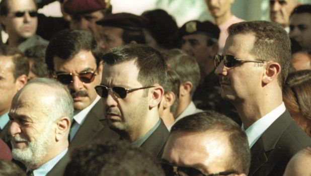 President Bashar al-Assad (right) and his brother Maher (centre) attend the funeral of their father Hafez, Damascus, June 13th 2000 (Getty/AFP/Ramzi Haidar)