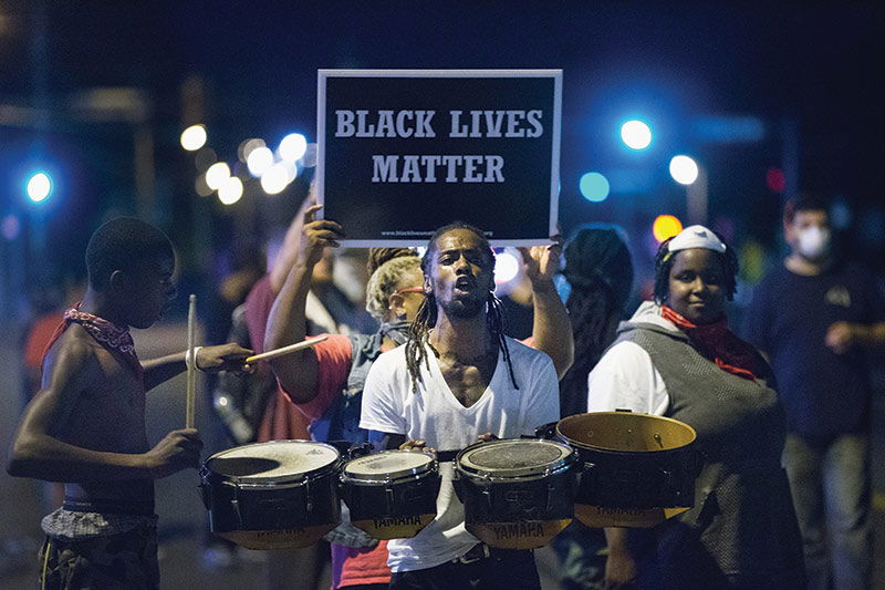 Demonstrators mark the first anniversary of the shooting of Michael Brown, Ferguson, Missouri, 10 August 2015. (Scott Olson / Getty) Demonstrators mark the first anniversary of the shooting of Michael Brown, Ferguson, Missouri, 10 August 2015. (Scott Olson / Getty)