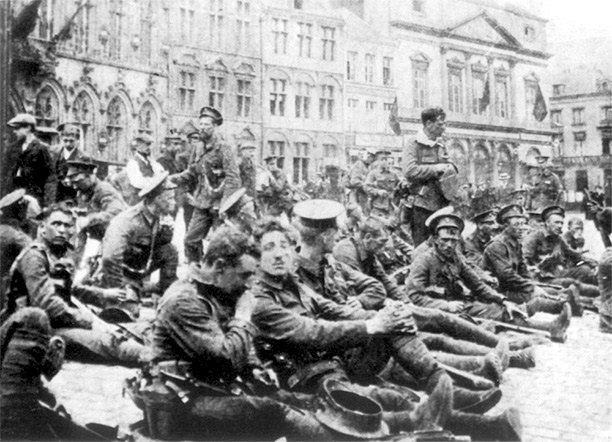 British troops from 4th Royal Fusiliers resting in the square at Mons 22 August 1914, the day before the Battle of Mons