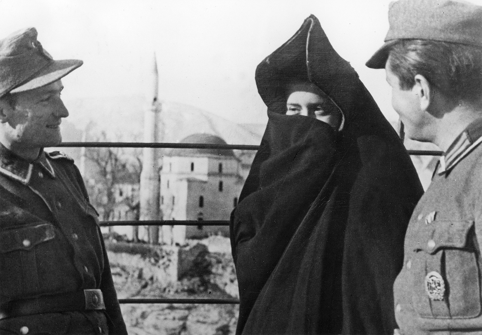 German soldiers talk to a Muslim woman in Mostar, Herzegovina, 1944.