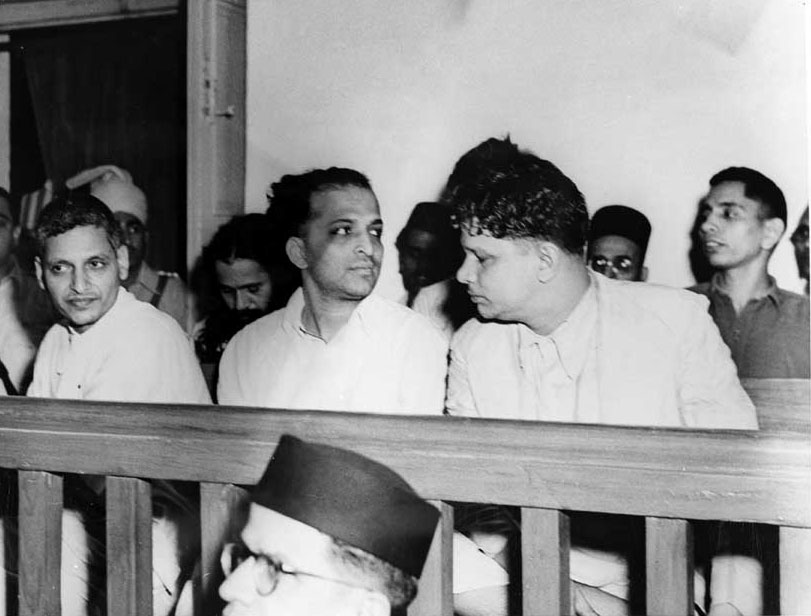 Nathuram Vinayak Godse, seated on the left of the front row, at the trial.