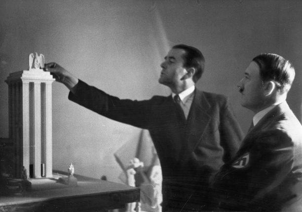 Albert Speer presents Hitler with a model of the German Pavilion designed for the World's Fair in Paris, 1937.