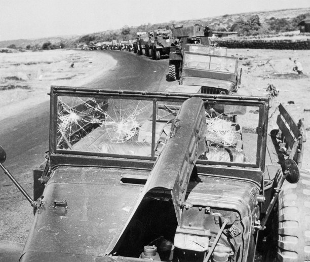 Damaged Portuguese military vehicles line the route to Panjim Airport, Goa, December 19th, 1961. Corbis/Bettmann