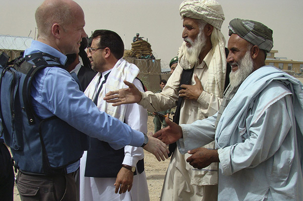 History man: William Hague shakes hands with Afghan elders during his visit to Helmand province, May 2010. AP Photo/Abdul Khaleq 