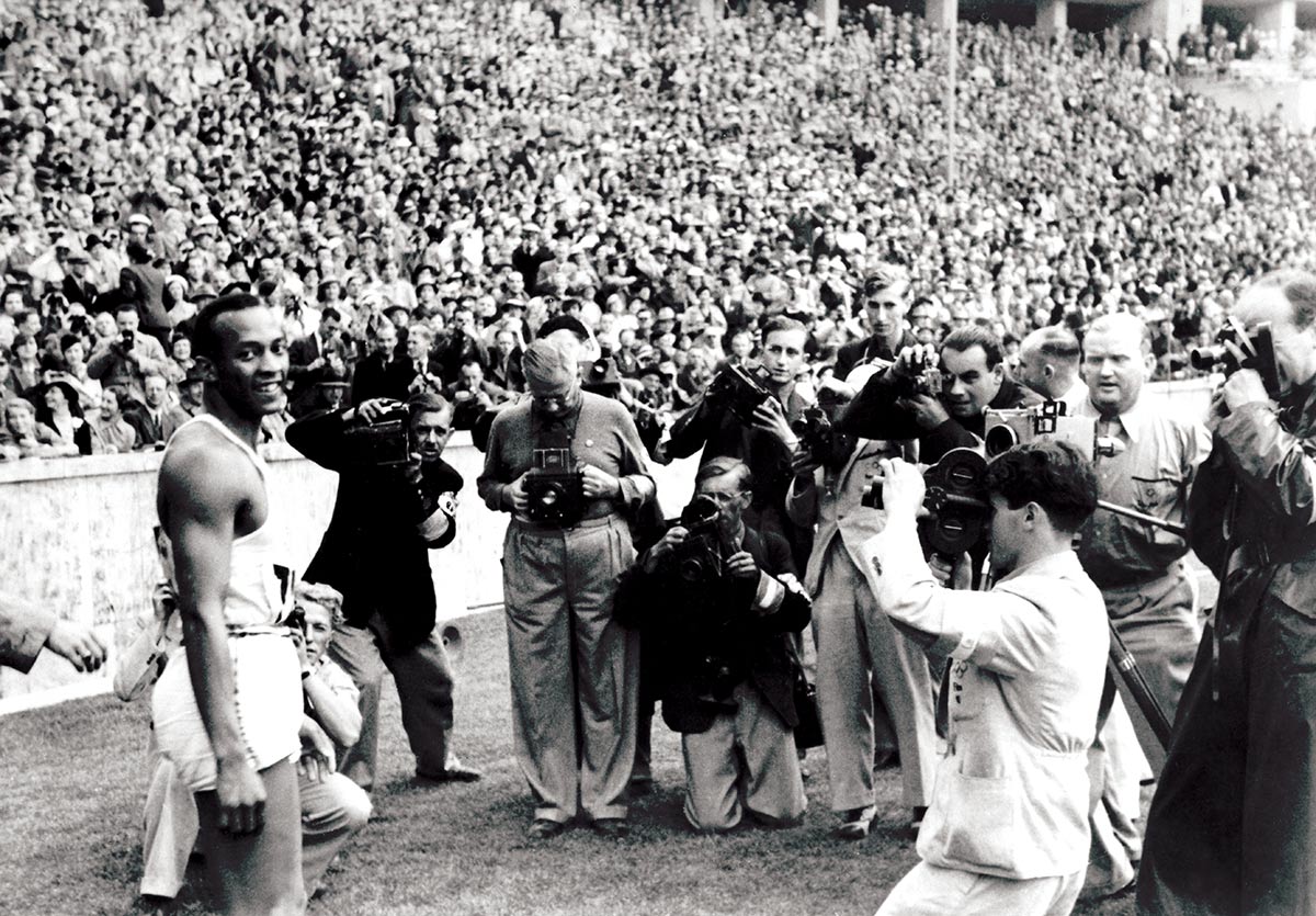 Defiant: Jesse Owens after winning the 100m at the Berlin Olympics, August 1936 © Getty Images 
