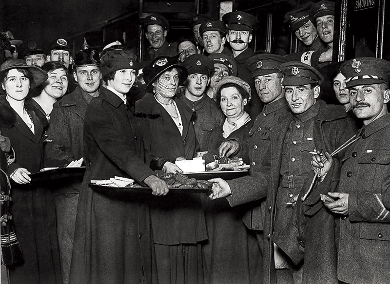 Equal rewards: returning soldiers are welcomed at a railway station, 1917.