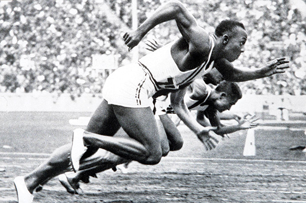 Race winner: Jesse Owens competing in the 100 metre sprint at the 1936 Olympics