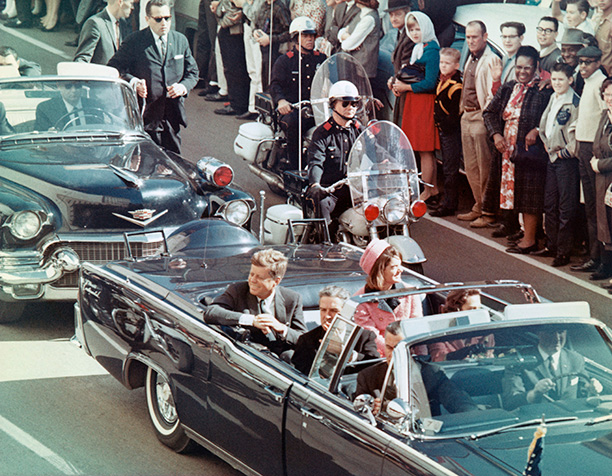 President and Mrs Kennedy in the Dallas motorcade, moments before the shooting. Governor John Connally sits in front of the president. Corbis/Bettmann
