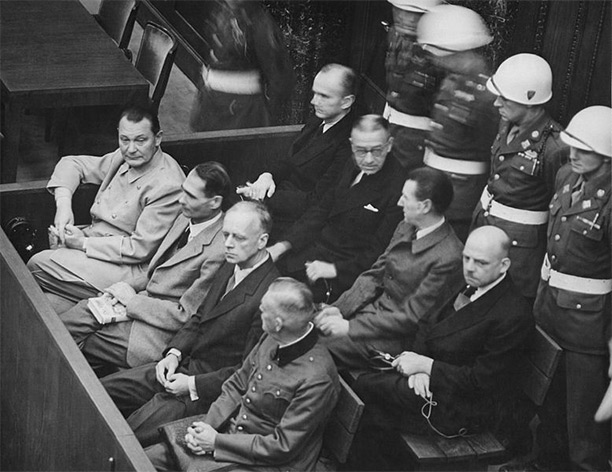 Defendants in the dock at the Nuremberg trial. On the left side of the front bench is Hermann Göring.. 