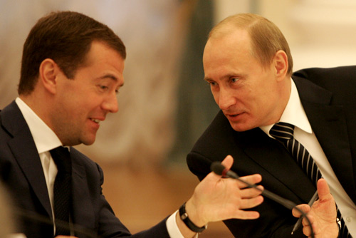 Vladimir Putin (r) with Dmitry Medvedev