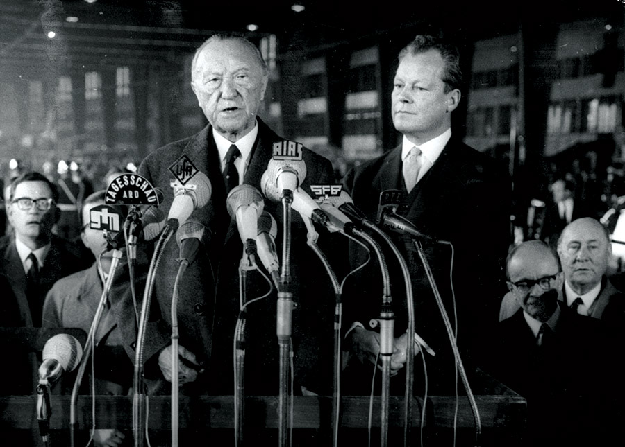 West German Chancellor, Konrad Adenauer, makes his farewell speech before resigning from office on 15 October 1963, with Willy Brandt, Chancellor 1969-74, on his left.