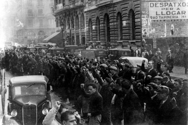 British volunteers with clenched fists gather in Barcelona, December 1936