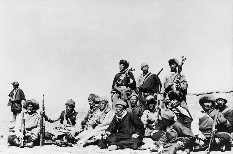 The 14th Dalai Lama (front, in black) flees Tibet for India with his Khamba warrior guards, 1959.