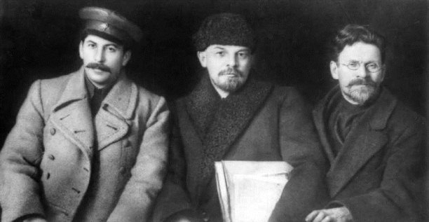 Falsified detail of a photo from the VIII Congress of the Russian Communist Party , March 1919. L-R: Stalin, Lenin, and Mikhail Kalinin