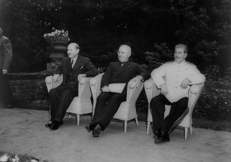 British prime minister Clement Attlee, US president Harry Truman, and Soviet leader Joseph Stalin, seated outdoors at Berlin conference, 1945. Library of Congress. Public Domain.