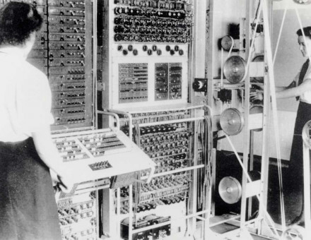 A Colossus Mark 2 codebreaking computer being operated by Dorothy Du Boisson (left) and Elsie Booker (right), 1943. National Archives.