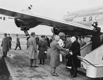 Photograph of President Truman greeting British Prime Minister Winston Churchill upon his arrival at Washington National Airport.
