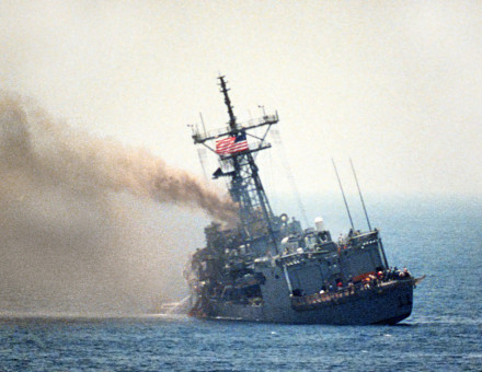USS Stark lists to port after being struck an Iraqi-launched Exocet missile in the Arabian Gulf, 17 May 1987. Department of Defense. Public Domain.