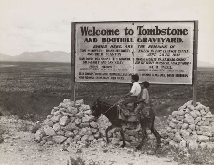 Sign entering Tombstone, Arizona mentioning the so-called Gunfight at the O.K. Corral, 1937. New York Public Library. Public Domain.