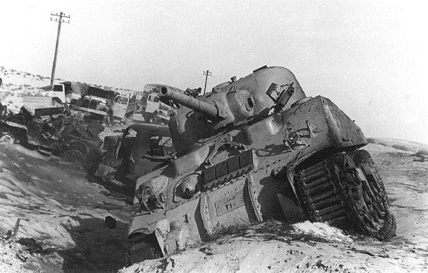 Destroyed Egyptian tank and vehicles litter the Sinai following heavy fighting, 1956