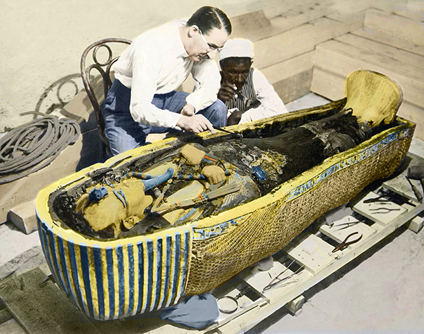 Rash intruders? Howard Carter and an Egyptian assistant examine the sarcophagus of Tutankhamun. Bridgeman/Leemage