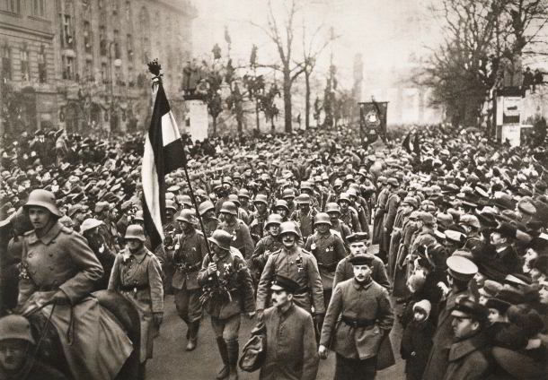 Crowds line the streets of Berlin as German soldiers return, hailed as 'undefeated', at the end of the war, 1918