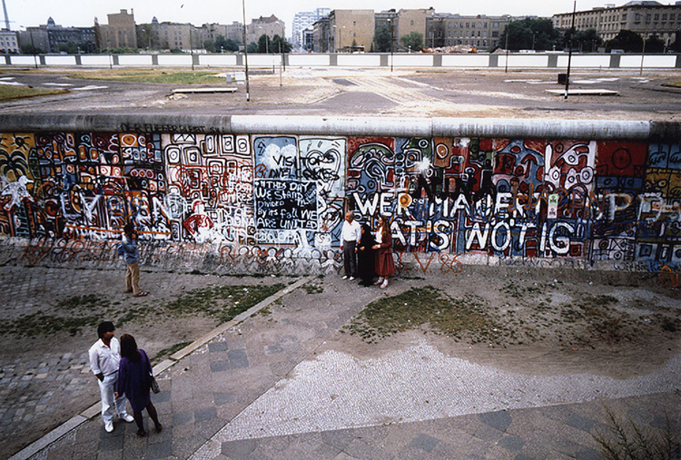 Tourists look at the Berlin Wall from a platform near Potsdamer Platz in 1986. Photo by Nancy Wong.