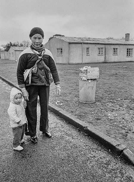 Vietnamese man and child at Sopley Refugee Camp, New Forest, 1980. (John Perivolaris)