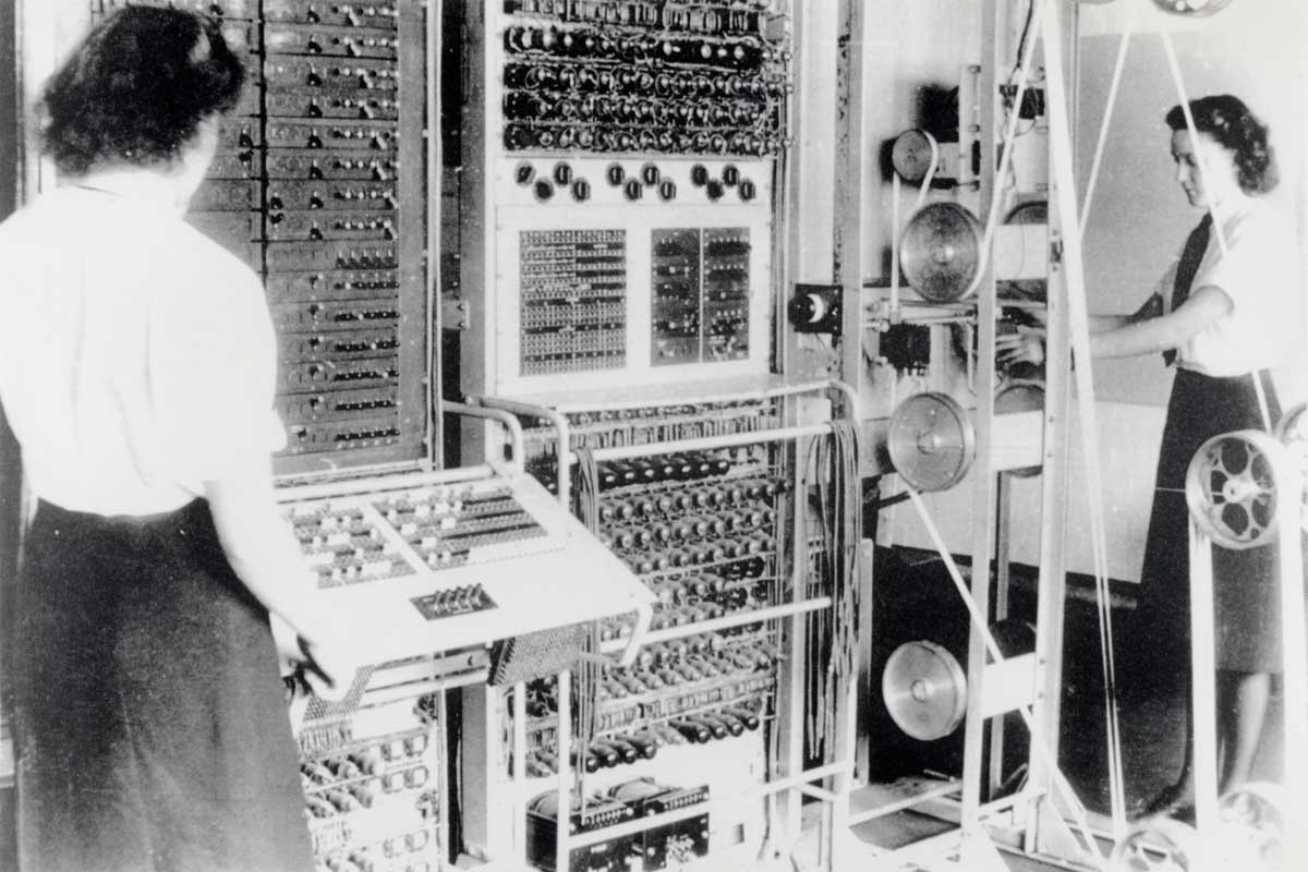 A Colossus Mark 2 codebreaking computer being operated by Dorothy Du Boisson (left) and Elsie Booker (right), 1943. National Archives.