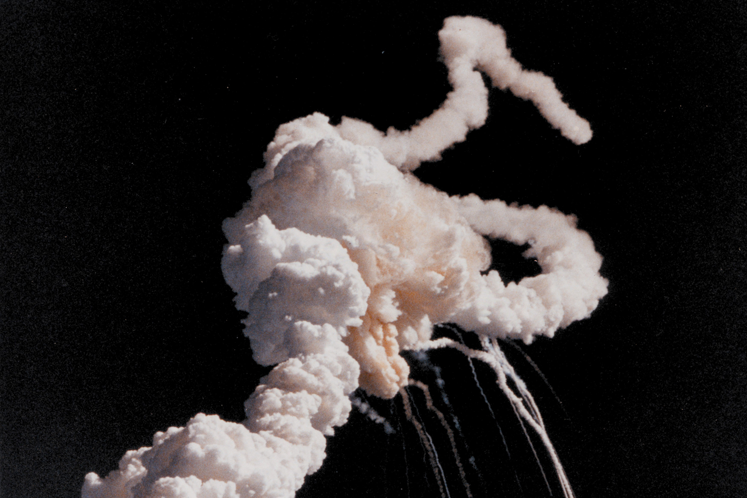 The Space Shuttle Challenger explodes shortly after takeoff, 28 January 1986.
