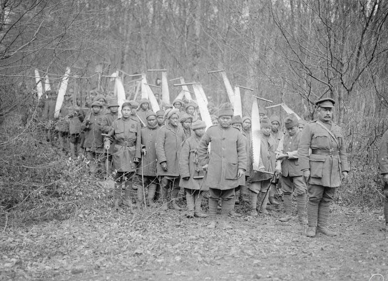 Men of an Indian Labour Corps company working at a forestry camp in the Foret de Lyons, 23 January 1918. Photograph: Ministry of Information/Imperial War Museum.