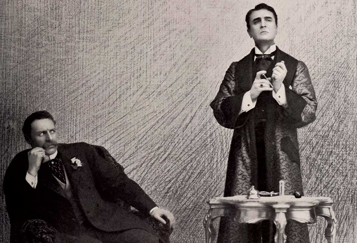Sherlock  Holmes, played by William Gillette, and his hypodermic. From a stage adaptation of Sherlock Holmes at the Garrick Theatre, London, 1899. Alamy.