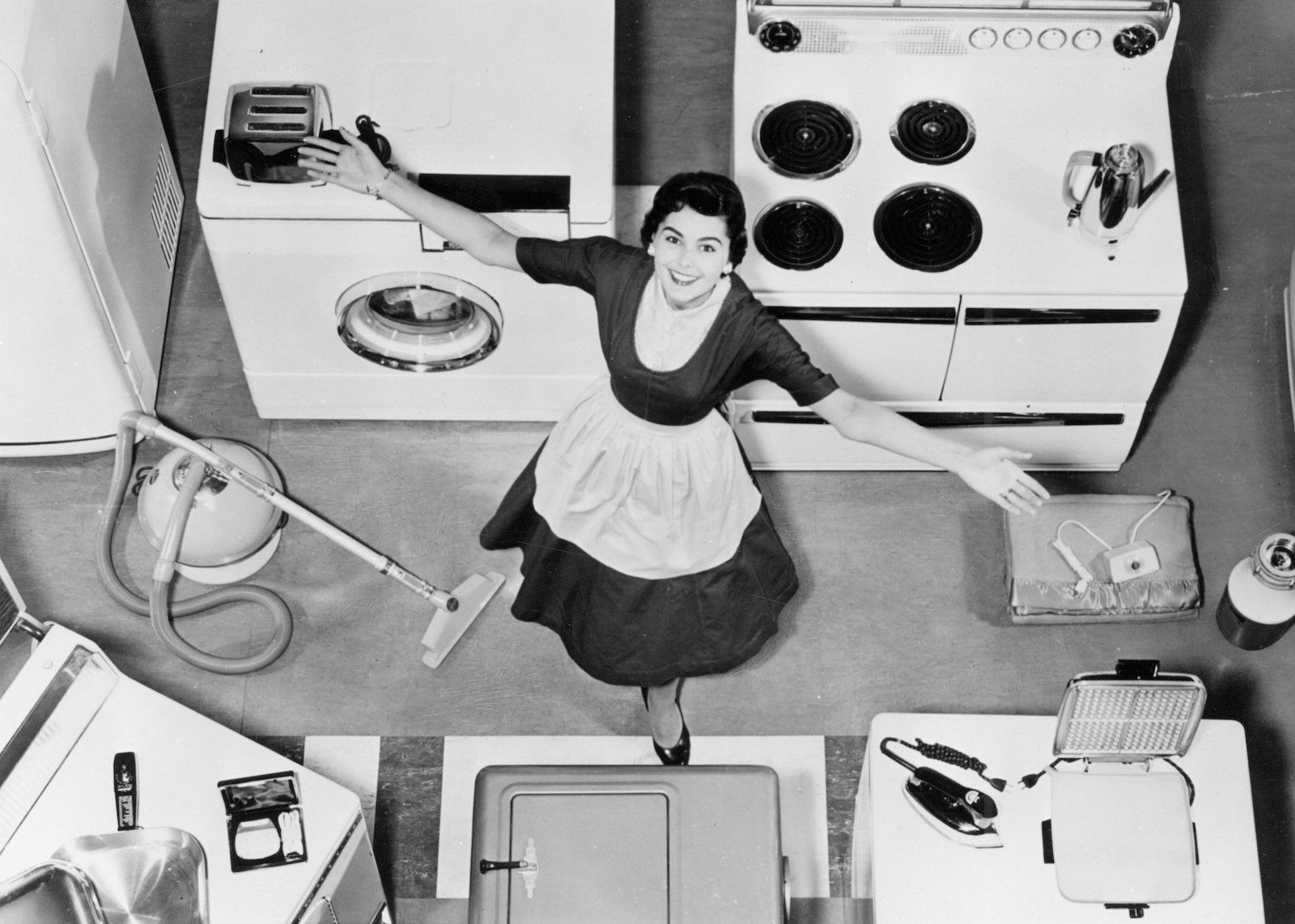 A woman models kitchen appliances in the late 1950s. From the Carolina Power and Light Photo Collection, State Archives of North Carolina. Public Domain.