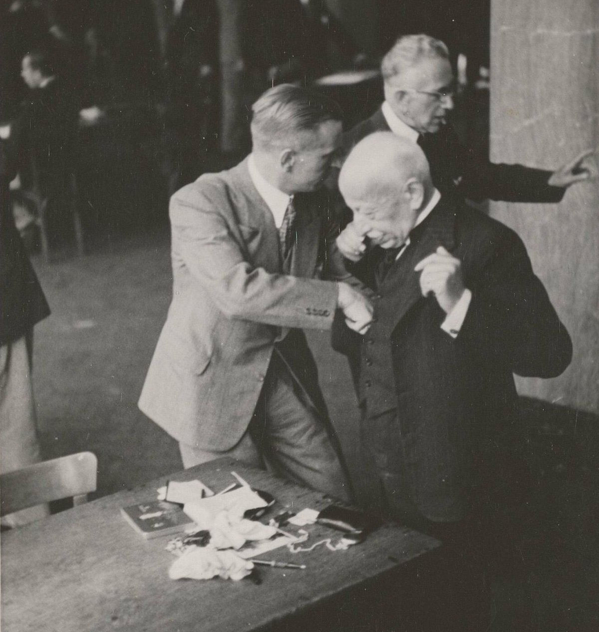 Jewish diamond merchants being searched at the Diamond Exchange, Amsterdam by order of the SS Devisenschutzkommando, 16 April 1942. Bart de Kok/Amsterdam City Archives OKBB00024000039.