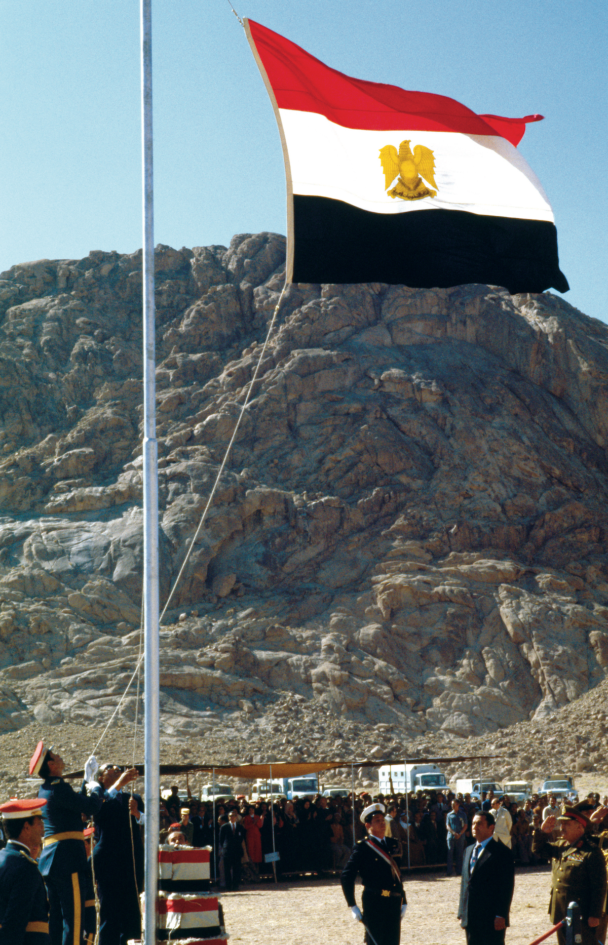 Anwar Sadat raises the Egyptian flag over Sinai, 26 May 1979. William Karel/Getty Images.