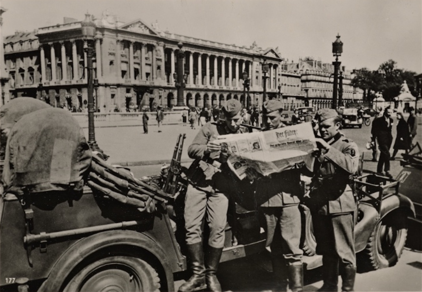 German soldiers studying a newspaper from home on the Place de la Concorde in Paris, 1940. New York Public Library. Public Domain.