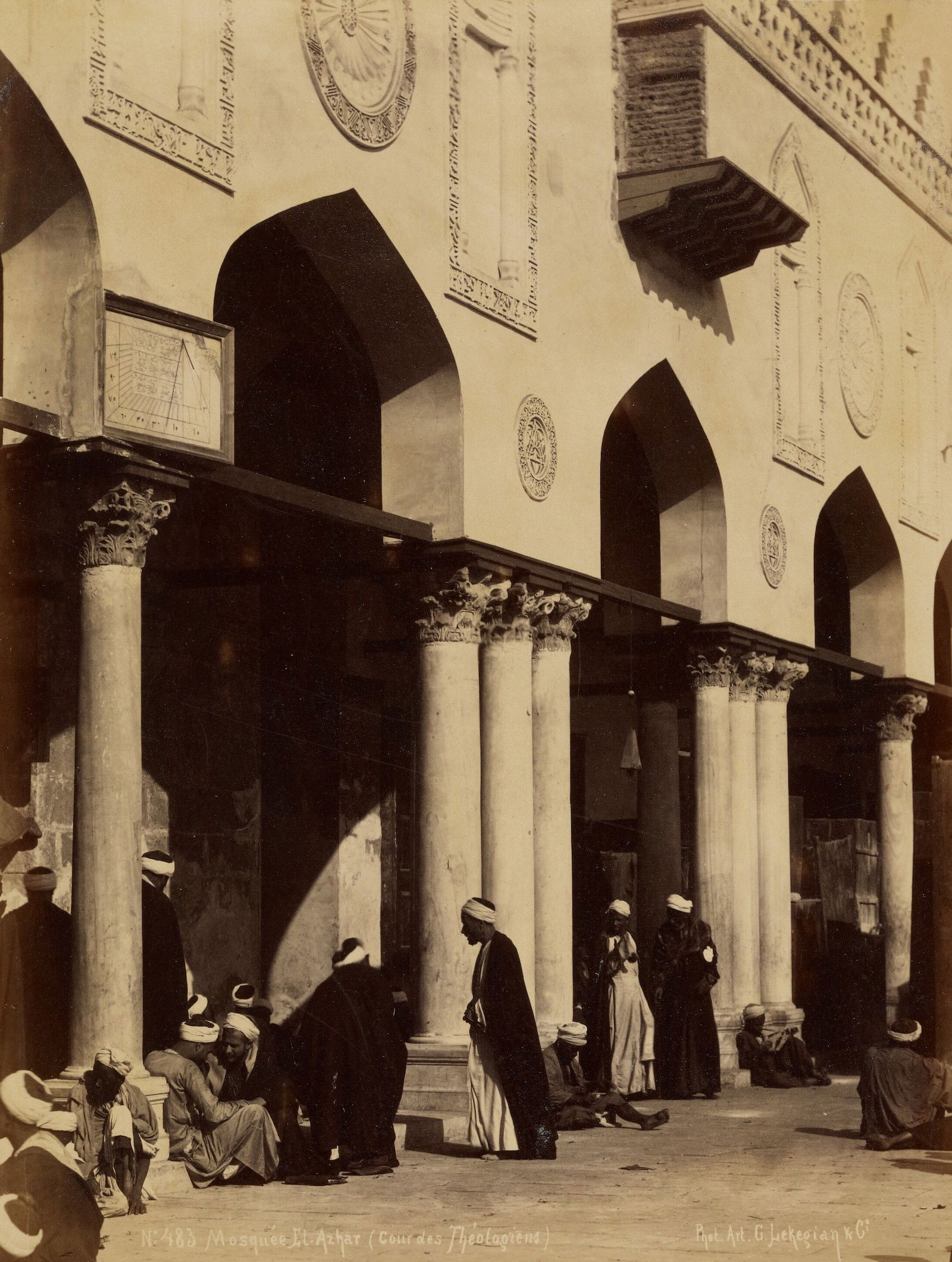 Men gather outside the Al-Azha Mosque, built by the Fatamids, by G. Lekegian. The J. Paul Getty Museum, Los Angeles. Public Domain.