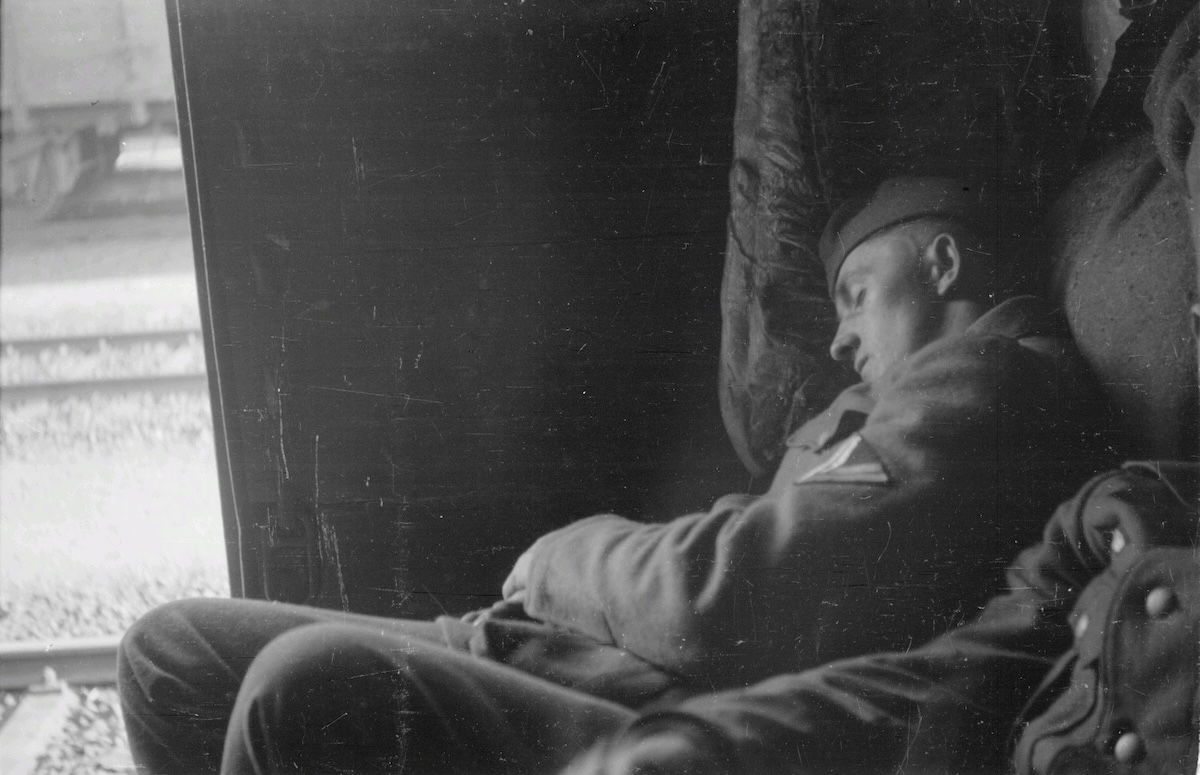 A German soldier sleeps in a railway wagon on his way to the Eastern Front, by Franz Grasser, 1943. Deutsche Fotothek. Public Domain. A German soldier sleeps in a railway wagon on his way to the Eastern Front, by Franz Grasser, 1943. Deutsche Fotothek. Public Domain.