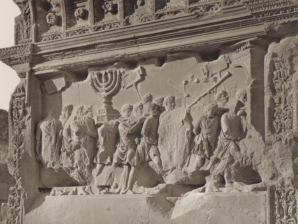 Frieze panel showing triumphant Romans carrying the seven-branched menorah from the Temple of Jerusalem from the Arch of Titus, Rome, by Edizione Brogi, c.1875-1907. Rijksmuseum. Public Domain. Frieze panel showing triumphant Romans carrying the seven-branched menorah from the Temple of Jerusalem from the Arch of Titus, Rome, by Edizione Brogi, c.1875-1907. Rijksmuseum. Public Domain.