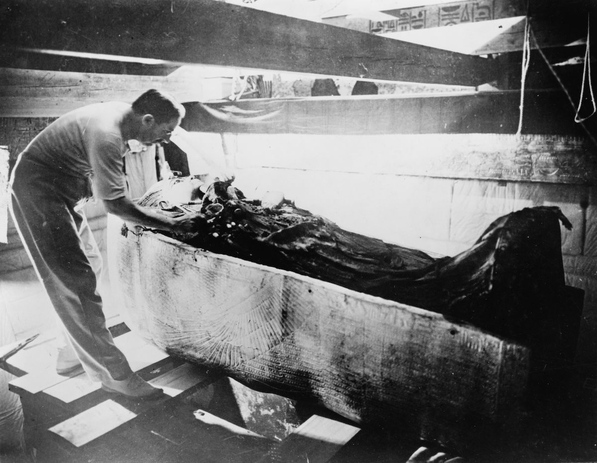 Howard Carter turning back a shroud covering the inner coffin of Tutankhamen, 4 March 1926. Library of Congress. Public Domain.