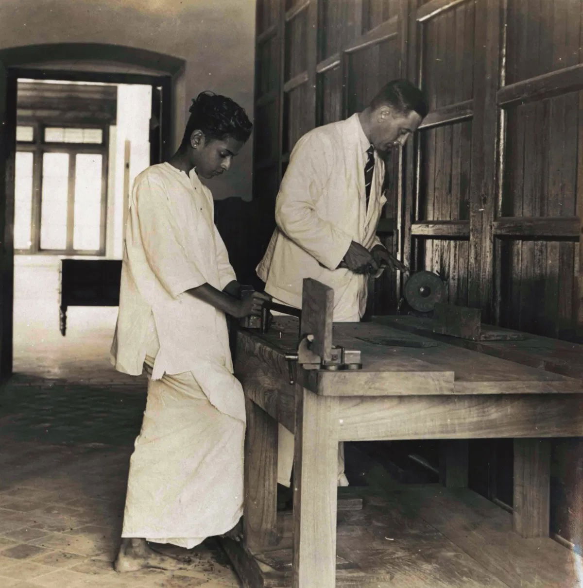 Maharajah Chithira Tirunal and G.T.B. Harvey having a carpentry lesson, c.1930. Archive of Modern Conflict.