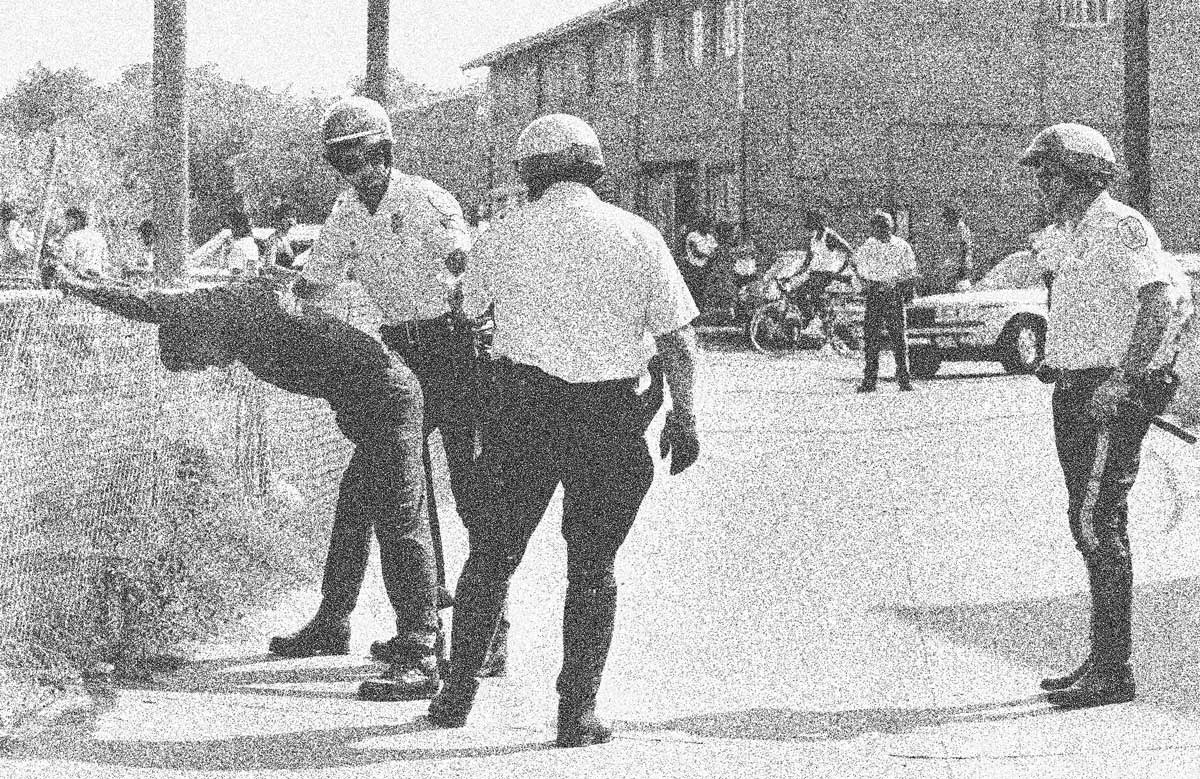 Police search a man following a drugs raid in Quarles Street, Washington, 19 July 1985. Linda Wheeler/The Washington Post/Getty Images.